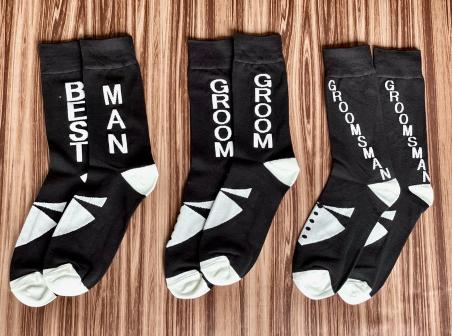 https://www.groovygroomsmengifts.com/cdn/shop/products/groomsmansocksandkoozie.png?v=1644446923